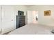 Comfortable bedroom featuring a TV, dresser, neutral walls, and view to another room at 13624 Jacks Ln, Pineville, NC 28134