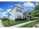 Well-maintained home featuring light-blue siding, black shutters, and lush landscaping on a sunny corner lot at 13624 Jacks Ln, Pineville, NC 28134