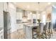 Elegant kitchen equipped with granite counters, white cabinets, modern island, and stainless steel appliances for culinary enthusiasts at 13624 Jacks Ln, Pineville, NC 28134