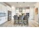 Bright kitchen featuring stainless steel appliances, island with seating, and ample counter space at 13624 Jacks Ln, Pineville, NC 28134
