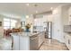 Kitchen with white cabinets, stainless steel appliances, and island with granite countertop at 13624 Jacks Ln, Pineville, NC 28134