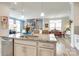Bright, open kitchen with granite countertops, a central island, and stainless steel appliances at 13624 Jacks Ln, Pineville, NC 28134