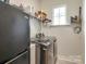 Convenient laundry room featuring a modern washer and dryer set at 13624 Jacks Ln, Pineville, NC 28134