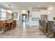 Open-concept living area with breakfast bar, dining area, and view of the home's entry and staircase at 13624 Jacks Ln, Pineville, NC 28134