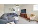 Comfortable living room showcasing a sectional sofa and entertainment center at 13624 Jacks Ln, Pineville, NC 28134
