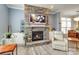 Inviting living area featuring a stone fireplace, hardwood floors, built-in shelves, and ample natural light at 13624 Jacks Ln, Pineville, NC 28134