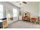 Bright office space, with a vanity and large mirror, providing a versatile room at 13624 Jacks Ln, Pineville, NC 28134