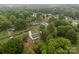 This aerial shot displays the home's position within a verdant, well-populated neighborhood with tree-lined streets at 1401 Thompson Ave, Charlotte, NC 28216
