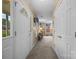 Inviting entryway with neutral colors, carpeted floor, coat closet, and a glimpse into the living room at 1401 Thompson Ave, Charlotte, NC 28216