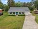 Charming home with blue shutters, front porch, and well-manicured lawn at 1401 Thompson Ave, Charlotte, NC 28216