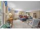 Spacious living room with neutral walls and carpet, large windows, and comfortable seating at 1401 Thompson Ave, Charlotte, NC 28216