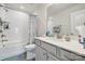 Bright bathroom with subway tile, shower-tub combo, and white vanity with ample counter space at 145 Marron Dr, Indian Trail, NC 28079