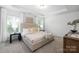Comfortable bedroom features carpet, recessed lighting, tray ceiling, and bedside tables at 145 Marron Dr, Indian Trail, NC 28079