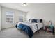 Bright bedroom with gray carpet and large windows that provide natural light at 145 Marron Dr, Indian Trail, NC 28079