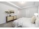 Inviting bedroom with neutral carpet, tray ceiling, drawers, and ample natural light at 145 Marron Dr, Indian Trail, NC 28079