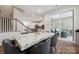 Spacious dining area boasts modern finishes, an open floor plan, and access to the outdoor deck at 145 Marron Dr, Indian Trail, NC 28079