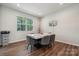 Bright dining room features hardwood floors, large window, and a modern marble table set at 145 Marron Dr, Indian Trail, NC 28079