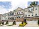 Attractive townhomes with stone accents, garages, and well-maintained landscaping at 145 Marron Dr, Indian Trail, NC 28079