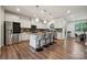 Bright kitchen with a large island, stainless steel appliances, and ample counter space at 145 Marron Dr, Indian Trail, NC 28079