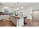 Granite island with seating in an open kitchen; great for entertaining and casual dining at 145 Marron Dr, Indian Trail, NC 28079