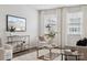 Bright living room featuring a large window, elegant décor, and comfortable seating arrangement at 145 Marron Dr, Indian Trail, NC 28079