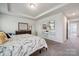 Spacious main bedroom with a large closet, neutral tones, and a mounted TV at 145 Marron Dr, Indian Trail, NC 28079