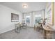 Well-lit office space with a glass-topped desk, a comfortable chair, and serene decor perfect for productivity at 145 Marron Dr, Indian Trail, NC 28079