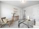 Bright home office featuring a glass desk, a comfortable chair, and a neutral decor to promote productivity at 145 Marron Dr, Indian Trail, NC 28079