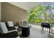 Cozy covered porch featuring comfortable seating and a stylish fire pit table at 145 Marron Dr, Indian Trail, NC 28079