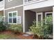 Townhome rear exterior with vinyl siding and landscaped yard at 145 Marron Dr, Indian Trail, NC 28079