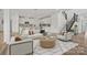 Comfortable living area with modern furniture, light colored accents, and staircase access at 1529 Gossage Nw Ln, Concord, NC 28027