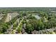 Aerial view of neighborhood with pond and mature tree cover at 16117 Wrights Ferry Rd, Charlotte, NC 28278