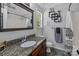 Well-decorated bathroom featuring granite countertops, modern fixtures, and stylish decor at 16117 Wrights Ferry Rd, Charlotte, NC 28278
