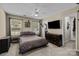 A spacious bedroom with a ceiling fan and ample natural light from the windows at 16117 Wrights Ferry Rd, Charlotte, NC 28278