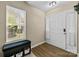 Bright entryway features a window bench, storage, and vinyl flooring for a clean, modern feel at 16117 Wrights Ferry Rd, Charlotte, NC 28278