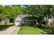 Landscaped front yard featuring a well-maintained lawn and a charming single-story home at 16117 Wrights Ferry Rd, Charlotte, NC 28278