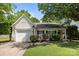 Charming single-story home with a well-maintained lawn and attached garage, offers cozy suburban living at 16117 Wrights Ferry Rd, Charlotte, NC 28278