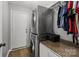 Convenient laundry area with stacked washer and dryer and storage at 16117 Wrights Ferry Rd, Charlotte, NC 28278