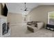 Inviting living room with natural light, fireplace, and vaulted ceiling for a comfortable ambiance at 16117 Wrights Ferry Rd, Charlotte, NC 28278