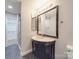 Elegant bathroom with a dark vanity, marble countertop, and glass shower at 1847 J Julian Ln # A, Charlotte, NC 28208