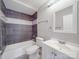 Tiled bathroom featuring modern fixtures and a sleek vanity at 1847 J Julian Ln # A, Charlotte, NC 28208