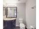 A clean bathroom featuring a sleek, dark vanity with light countertop and backsplash at 1847 J Julian Ln # A, Charlotte, NC 28208