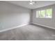 A cozy bedroom with plush carpeting, neutral walls and a bright window at 1847 J Julian Ln # A, Charlotte, NC 28208