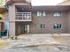 Multi-story condo with exterior balcony, neutral paint, and garden details at 1847 J Julian Ln # A, Charlotte, NC 28208