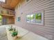 Condo building featuring a wooden exterior, second story balcony and tidy landscaping at 1847 J Julian Ln # A, Charlotte, NC 28208