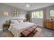 This bedroom features an ceiling fan, natural light, and tasteful decorations at 1847 J Julian Ln # A, Charlotte, NC 28208