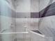 Luxurious tiled shower with sleek fixtures and built-in seat at 1847 J Julian Ln # A, Charlotte, NC 28208