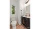 Stylish half bathroom with unique vanity and modern fixtures at 1847 Vinton St, Charlotte, NC 28216