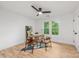 Bright bedroom featuring hardwood floors, a ceiling fan, a desk, and two windows providing ample natural light at 1847 Vinton St, Charlotte, NC 28216