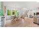 Bright dining area featuring a modern chandelier, natural light, and an open staircase at 1847 Vinton St, Charlotte, NC 28216